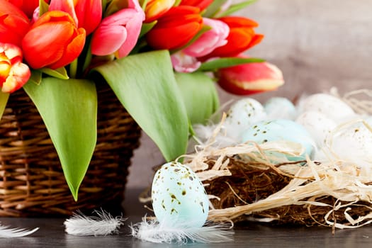 festive traditional easter egg decoration ribbon and tulips on wooden background