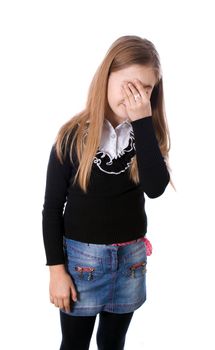 Side portrait of a beautiful girl crying and covering her face isolated on white