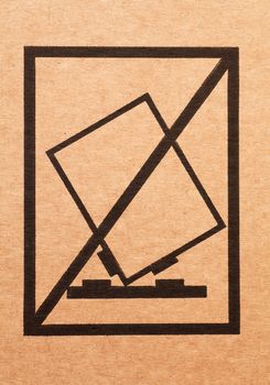 Handle with care sign on a cardboard box