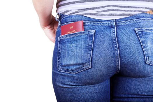 Shot of young womans behind in worn out jeans and passport in a pocket