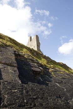 cliff face view of castle ruins in Ballybunion county Kerry Ireland