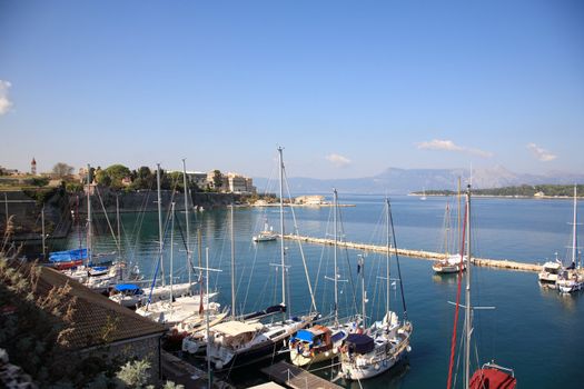 small marina with sail boats in the town of corfu