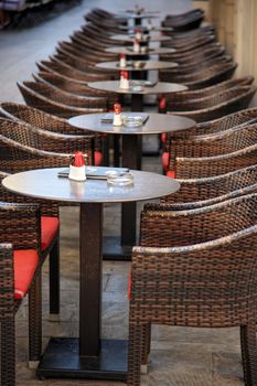 tables and chairs of a coffee shop in corfu