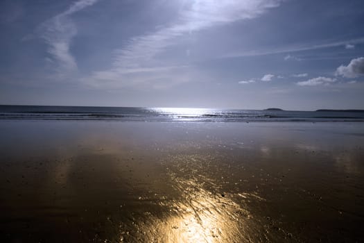 sunshine over the golden beach in Youghal county Cork Ireland on a summers day