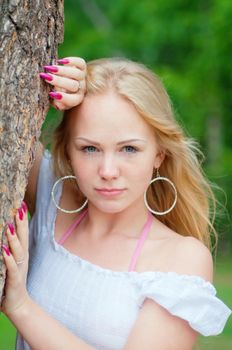 Portrait  young girl in a pine wood.Shallow depth-of-field.