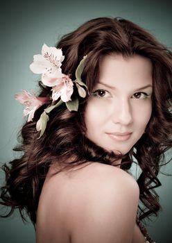 Portrait of beautiful girl with flowers in her hair