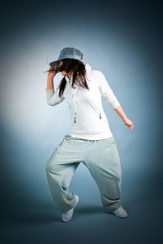 modern style dancer posing on  gray background