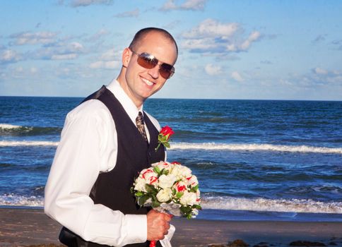 Groom with a Bridal Bouquet on a beach side