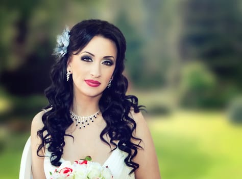 close up of a beautiful bride in the park 