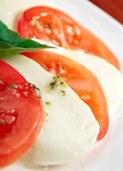 Italian cuisine.Arrangement of mozzarella and tomatoes