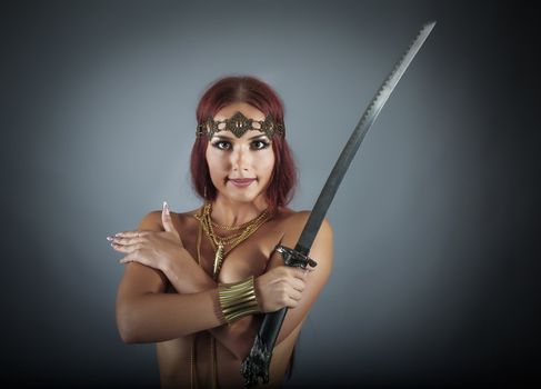 young warrior woman holding sword in her hand