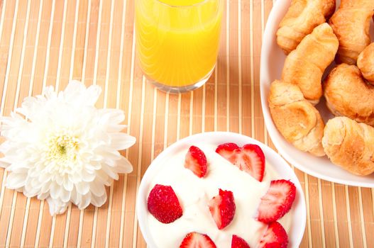 Breakfast with berries,orange juice and croissant, early breakfast