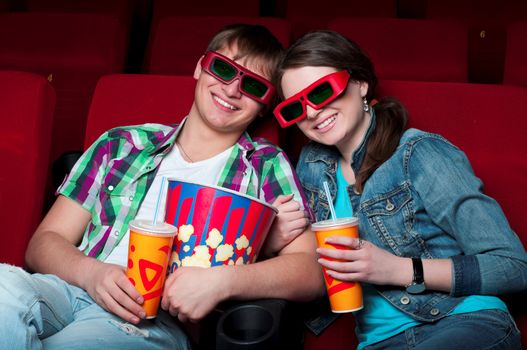 couple in a movie theater, watching a 3D movie