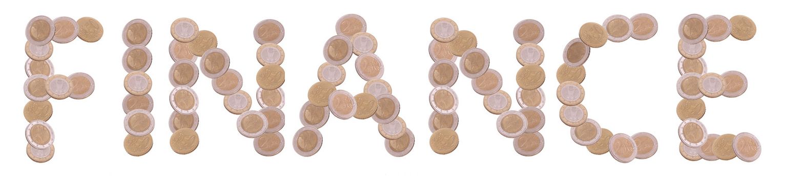 finance - written with coins on white background