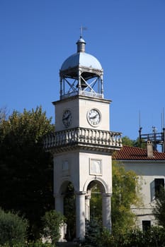 beautiful clock tower in a garden