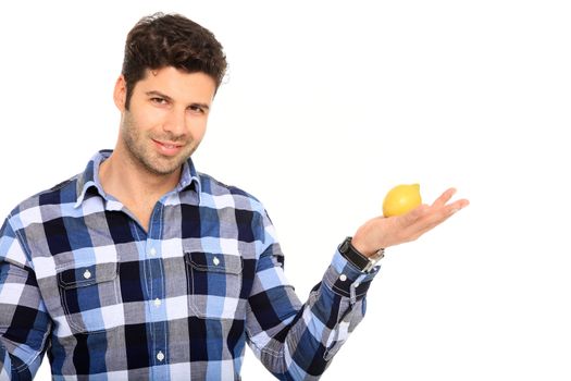 handsome man with a lemon in his hands isolated on a white background