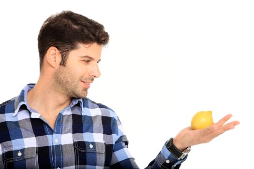 handsome man with a lemon in his hands isolated on a white background