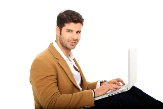 young handsome man holding a laptop isolated on a white background