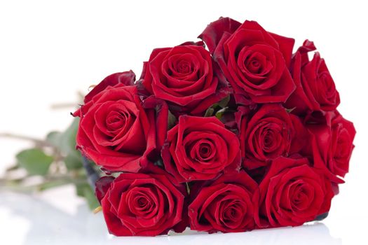Bouquet of red roses laying on a white background