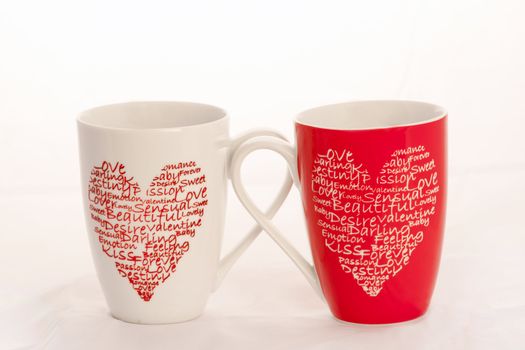 2 coffee cups with hearts on a white background