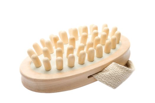 Wooden massage brush isolated over white