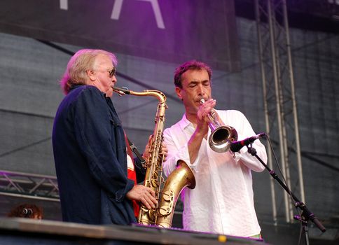 German saxophonist Klaus Doldinger performs with Austrian musician Hubert von Goisern at the Linz Europa Hafenfest 2009