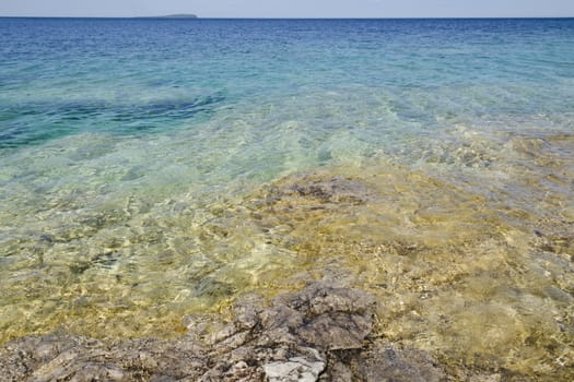 Rock under clear water at shore of Georgian Bay of Lake Huron Ontario