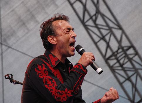 Austrian singer-songwriter Hubert von Goisern performs on stage at the Linz Europa Hafenfest 2009