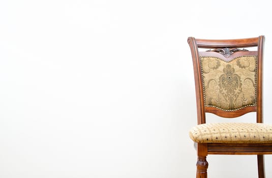 Classic chair on white wall background