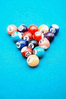 Pool game balls on blue felt table