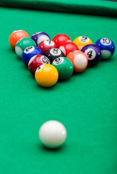 Pool game balls on green felt table