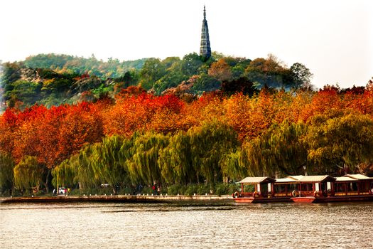 Ancient Baochu Pagoda Boats West Lake Hangzhou Zhejiang China .  Pagoda was constructed in 963AD