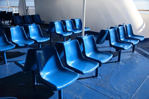 plastic blue chairs of a cruise ship