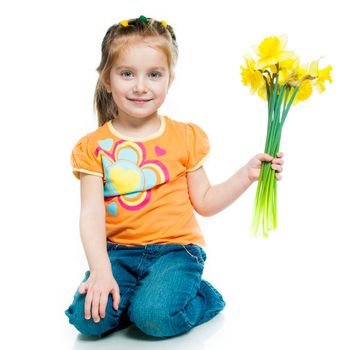 Happy little girl with flowers on a white background