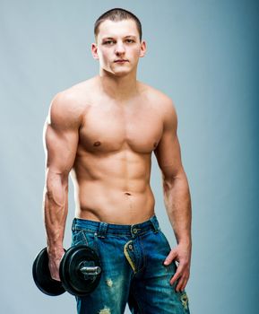 attractive athletic man with dumbbells