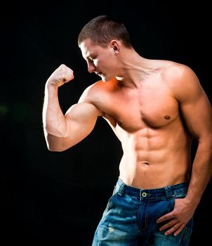 attractive athletic man showing his biceps