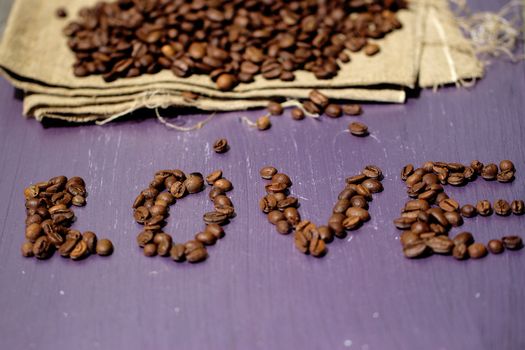 Close-up of coffee beans with chamomile