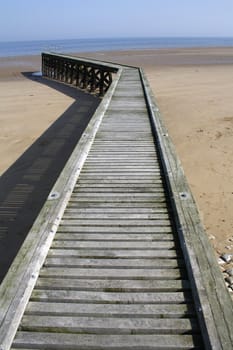 One pier on the beach of Grandcamp-Maisy, Normandy, France.
