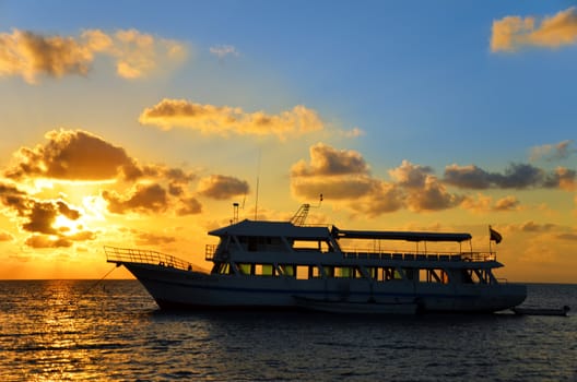 A boat at sunrise in the Caribbean in San Andres, Colombia