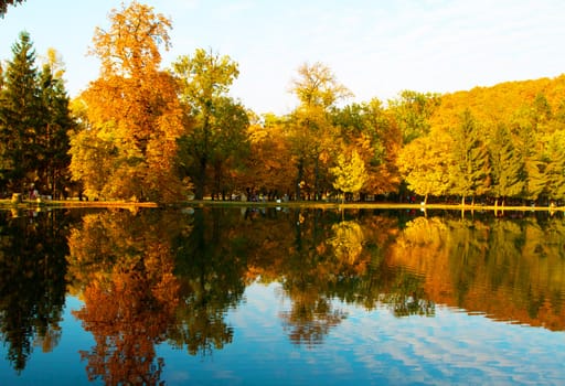 Beautiful colors of autumn landscape by the lake