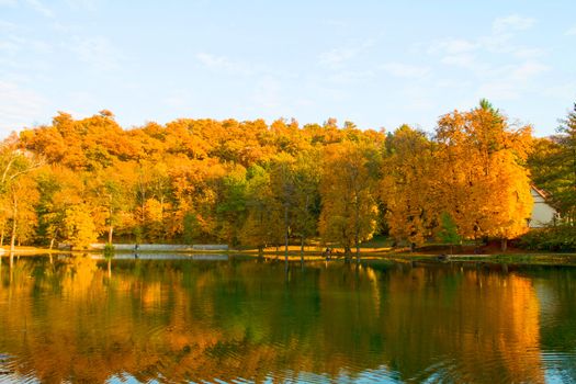 Beautiful colors of autumn landscape by the lake