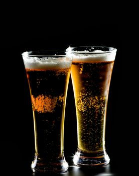 Two Glasses of Beer isolated on black background