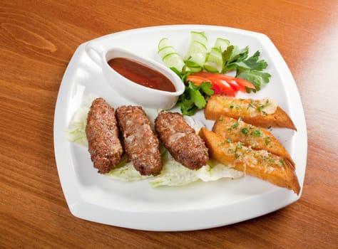 Italian cuisine.beef cutlets with vegetableon 