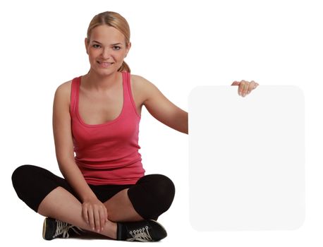 A young woman  holding an empty white bill board against a white background.