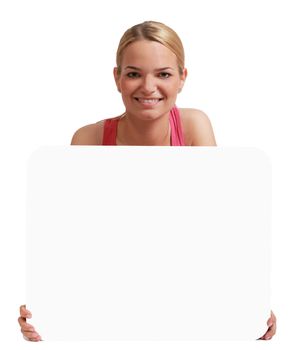 A young woman  holding an empty white bill board against a white background.