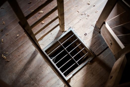 Convict cell entrance and ladder in old castle