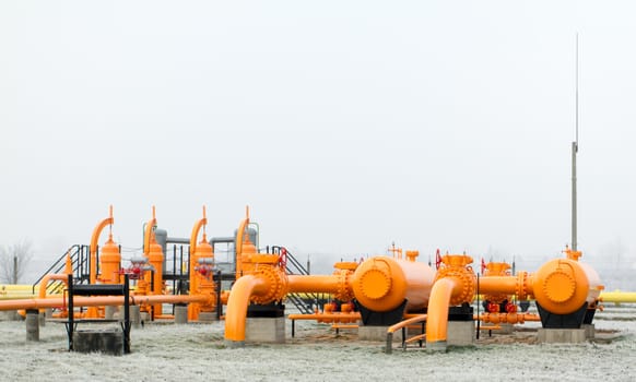 orange gas pipe in frosted winter