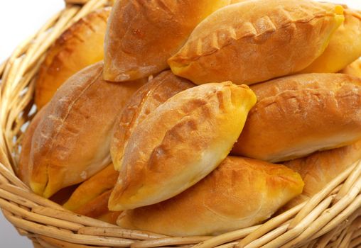 Basket full of pasties isolated  on white