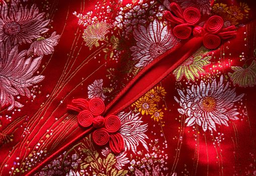 Traditional Chinese Red knot buttons on Cheongsam silk dress details 