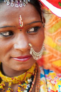 Traditional Indian woman in sari costume looking away, India